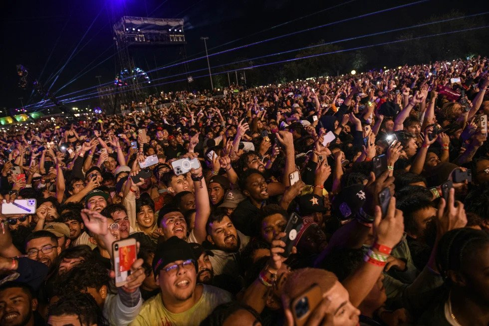The crowd watches as Travis Scott performs at Astroworld Festival at NRG park on Friday, Nov. 5, 2021 in Houston. (AP)