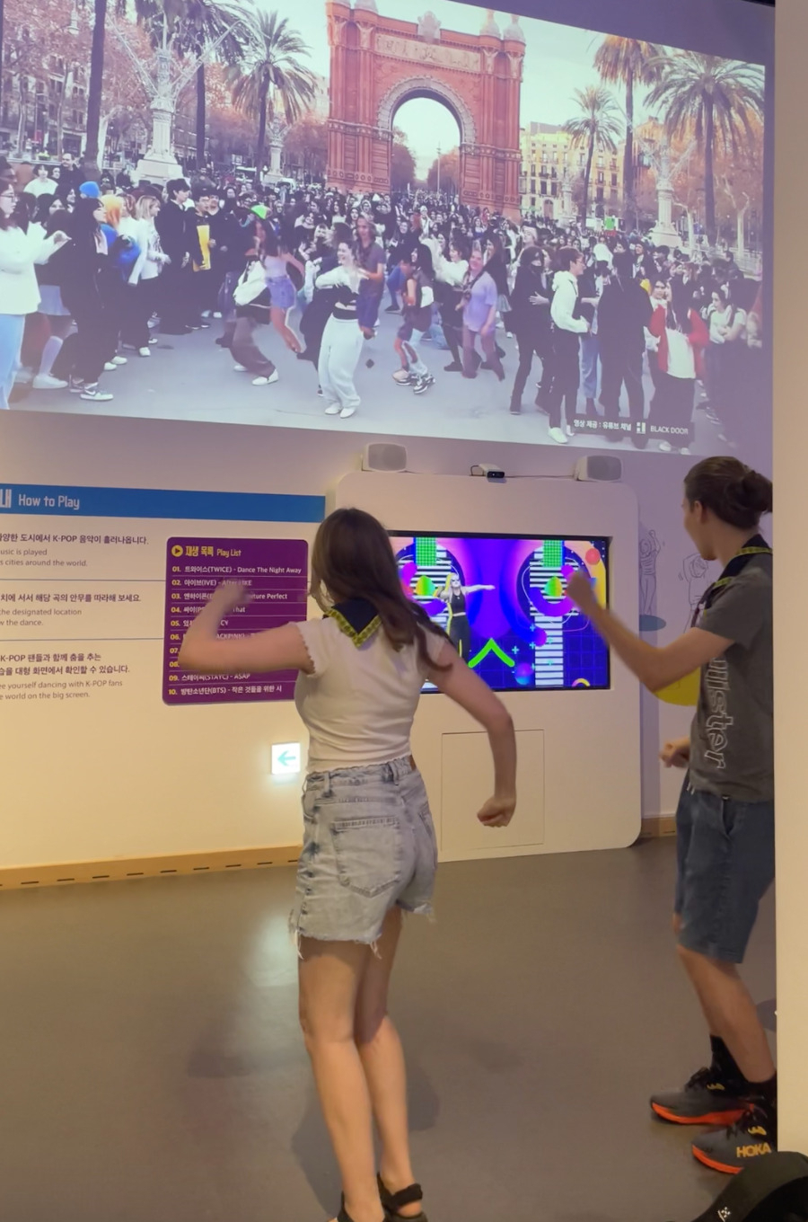 Visitors dance along with videos of K-pop Random Play Dance that took place at many cities around the world at an exhibition titled “The Pop Culture We Loved and Rise of the Korean Wave
