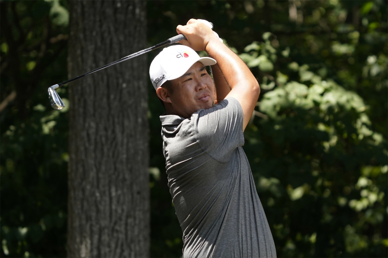 An Byeong-hun of South Korea watches his tee shot on the second hole during the final round of the Wyndham Championship at Sedgefield Country Club in Greensboro, North Carolina, on Sunday. (AP)