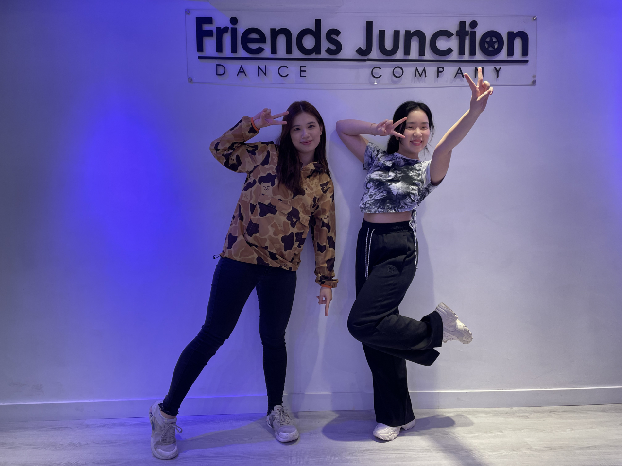 Vivo Fung Lok-yin (left) and Megan Leow Su Lynn pose for photos at a Friends Junction Dance Company studio in Hong Kong on March 21. (Naomi Ng/The Korea Herald)
