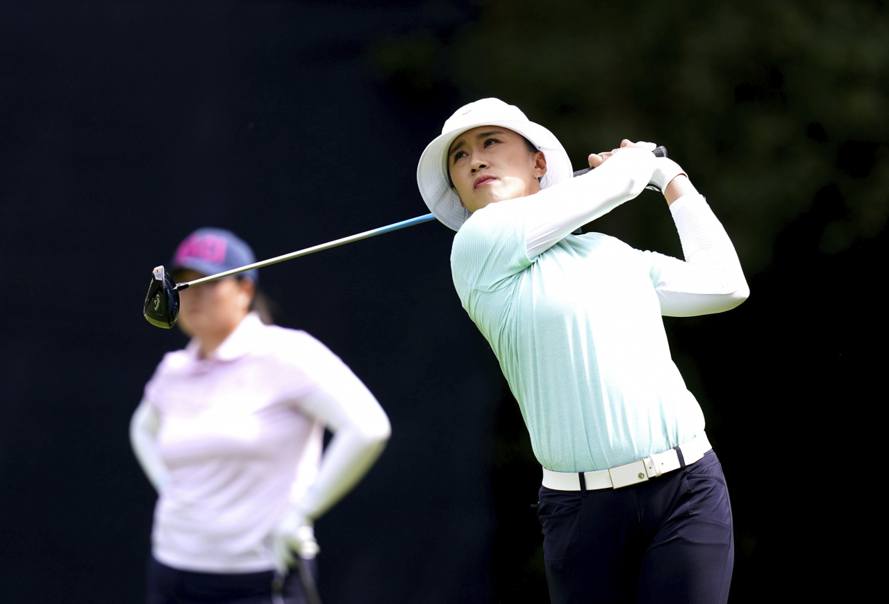 Amy Yang of South Korea tees off on the seventh hole during the first round of the AIG Women's Open at Walton Heath Golf Club in Surrey, England, on Thursday. (AP-Yonhap)