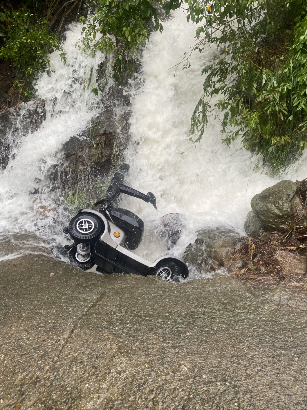 This photo, provided by Daegu fire authorities on Thursday, shows an electric wheelchair presumed to belong to a man who went missing during Typhoon Khanun. The vehicle was found near a flooded stream in the southeastern city. (Yonhap)