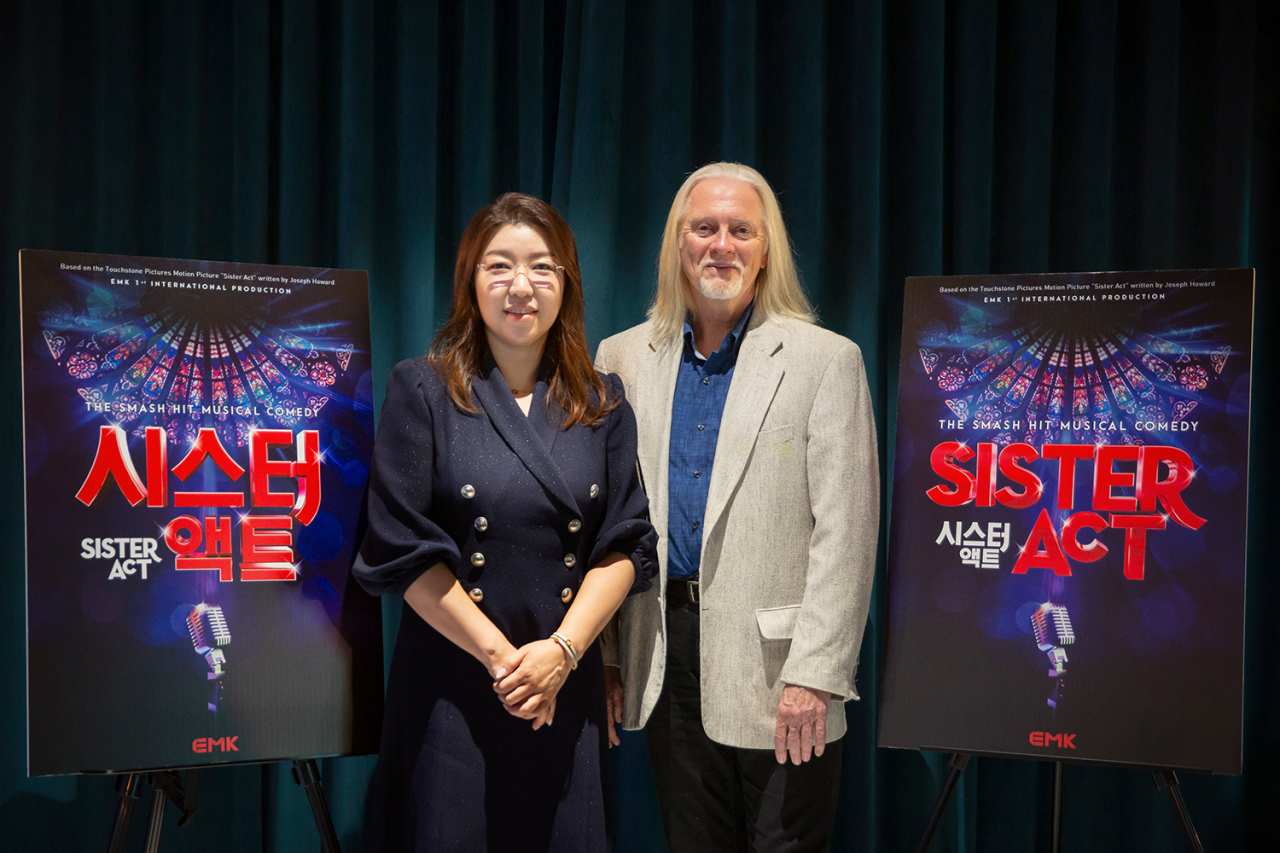 EMK International CEO and Producer Kim Ji-won (left) and director Robert Johanson pose for a photo during a press conference on Monday at EMK's headquarters in southern Seoul. (EMK)