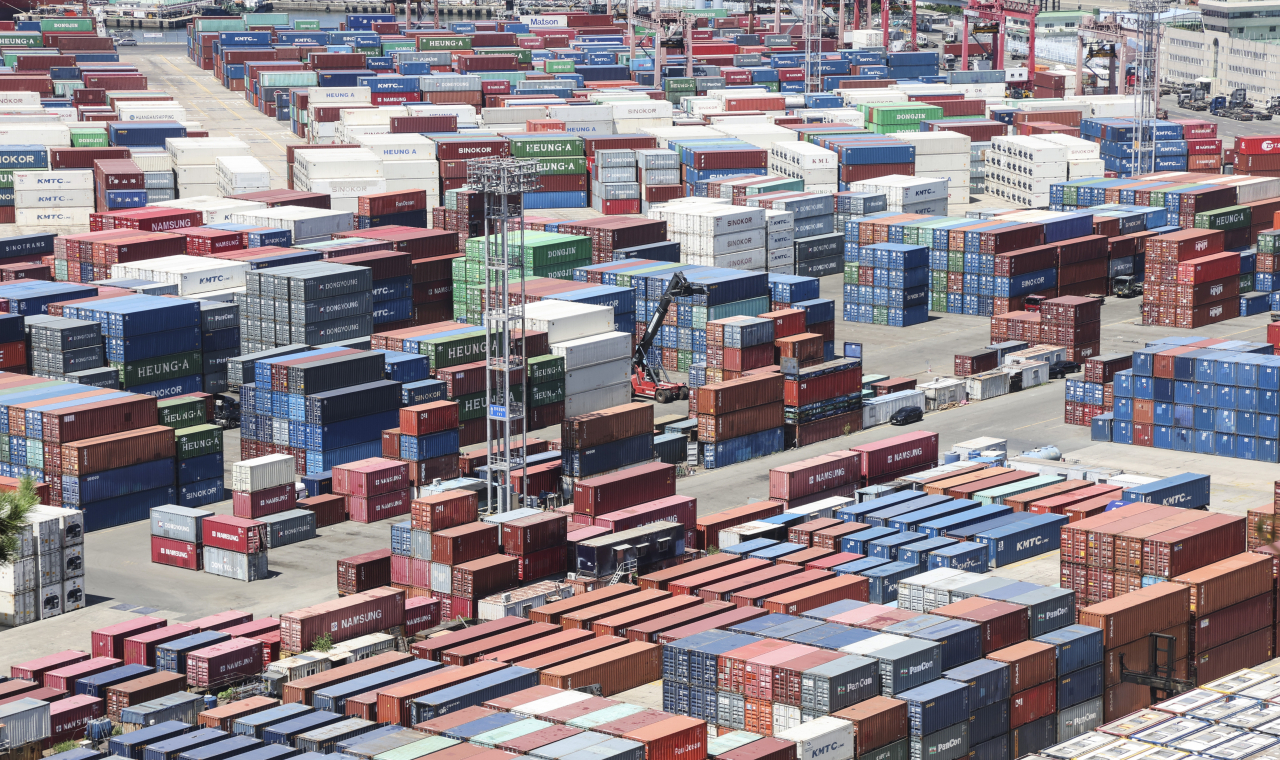 Shipping containers are stacked at a port in Busan, 320 kilometers south of Seoul, in this Aug. 1, file photo. (Yonhap)