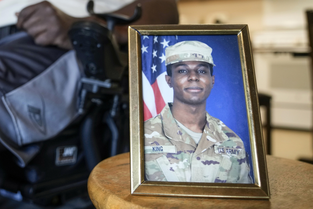 A portrait of American soldier Travis King is displayed as his grandfather, Carl Gates, talks about his grandson on July 19 in Kenosha, Wisconsin. (Photo - AP)