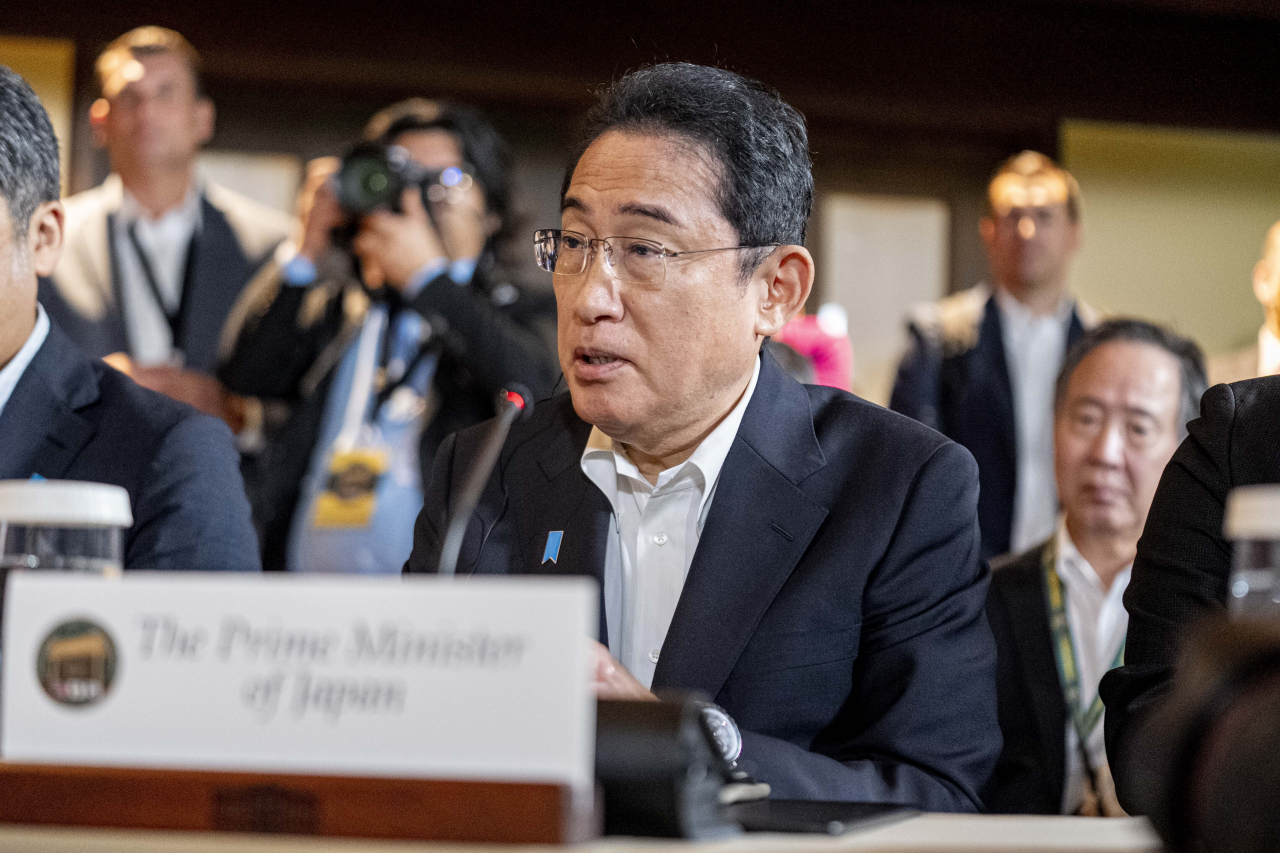 Japan's Prime Minister Fumio Kishida speaks during a meeting with President Joe Biden and South Korea's President Yoon Suk Yeol, Friday (local time), at Camp David, the presidential retreat, near Thurmont, Md. (AP/Yonhap)