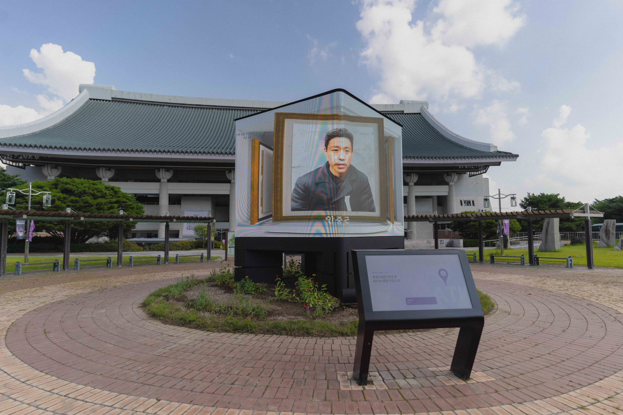 A media facade at the Independence Hall of Korea shows a video clip featuring revived images of independence fighters, including An Jung-geun (in the photo) through SK Telecom’s AI-powered digital remastering technology. (SK Telecom)