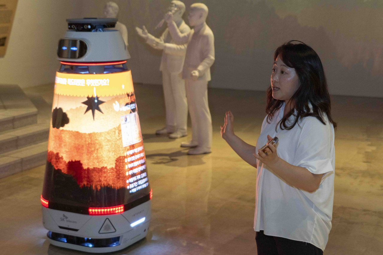 The AI media robot Nuri, powered by OpenAI's ChatGPT, moves around the exhibition space to explain the independence movement to visitors at the Independence Hall of Korea. (SK Telecom)