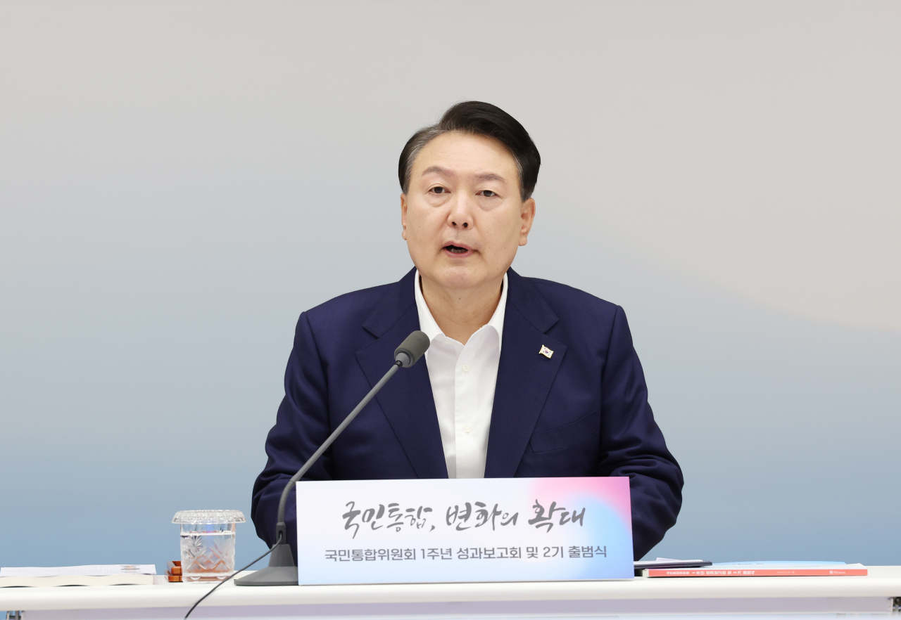 President Yoon Suk Yeol delivers his opening remarks at a meeting to assess the Presidential Committee of National Cohesion's first year of activities at the presidential office in Seoul on Friday. (Yonhap)