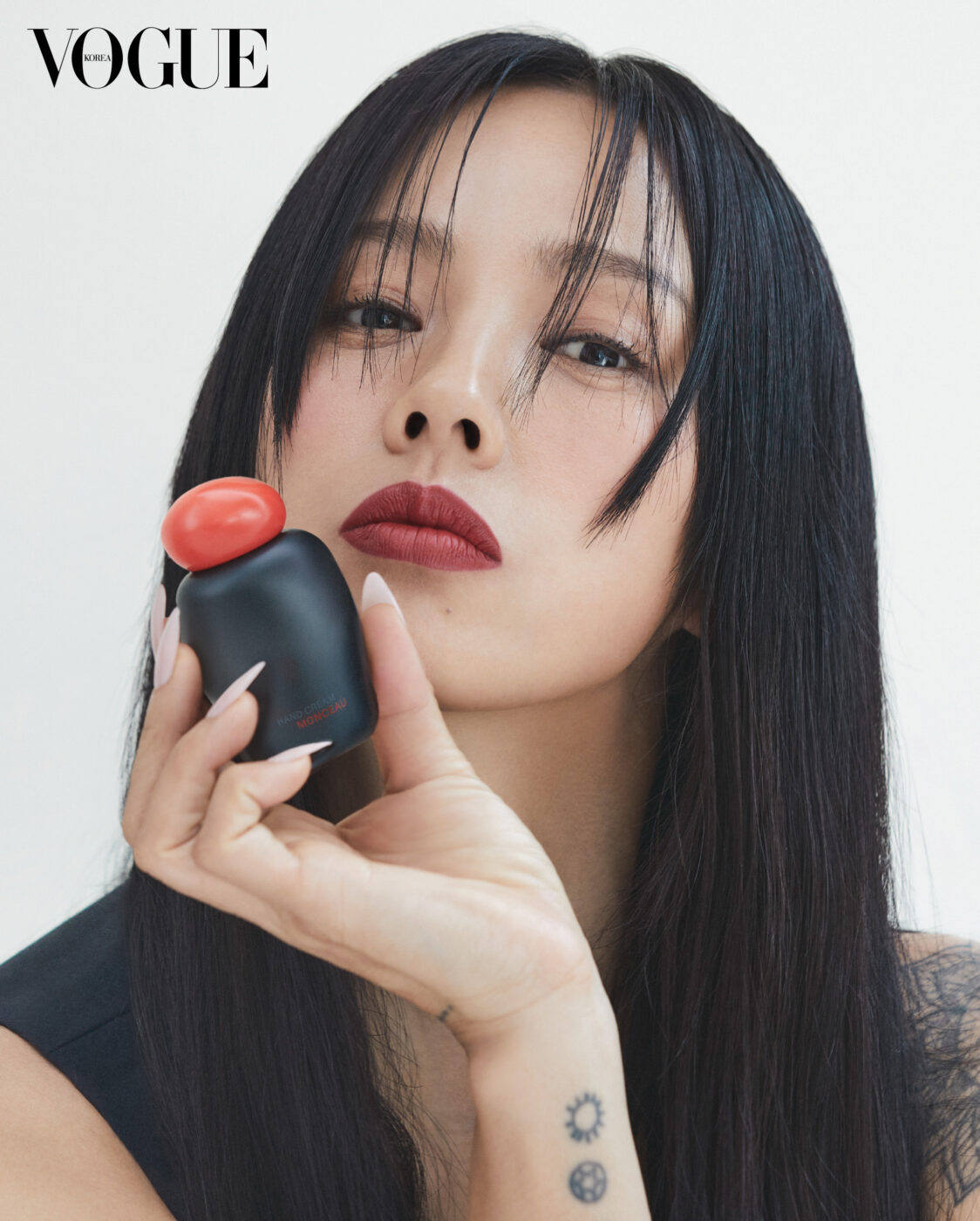 Former K-pop star and activist Lee Hyo-ri poses with Siita's new sustainable hand lotion for Vogue magazine. (Siita)