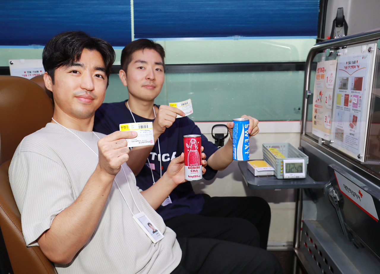 Dong-A Otsuka employees participate in a blood donation event held at the company's headquarters in Seoul, Tuesday. (Dong-A Otsuka)