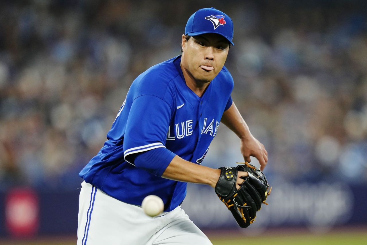 Toronto Blue Jays starter Ryu Hyun-jin fields a ball hit by Tyler Freeman of the Cleveland Guardians during the top of the second inning of a Major League Baseball regular season game at Rogers Centre in Toronto on Saturday. (Associated Press)
