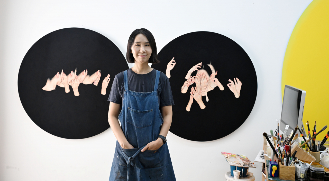 Lee Jin-ju stands at her studio in Paju, Gyeonggi Province, Friday. (Lee Sang-sub/The Korea Herald)