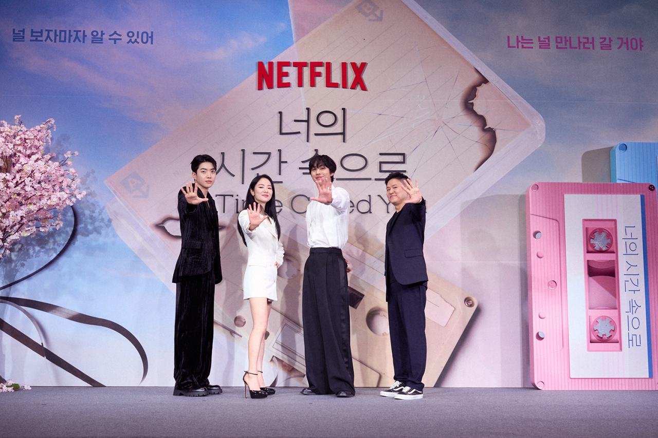 From left: Actors Kang Hoon, Jeon Yeo-been, Ahn Hyo-seop and director Kim Jin-won pose for photos before a press conference at the Ambassador Seoul -- A Pullman Hotel in Jung-gu, central Seoul, Monday. (Netflix)