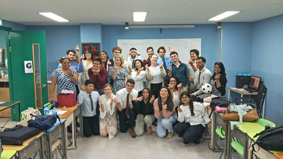 Annie poses for a picture with her program peers at TESOL Camp on Mock Teaching Day at XploreAsia in Seoul.