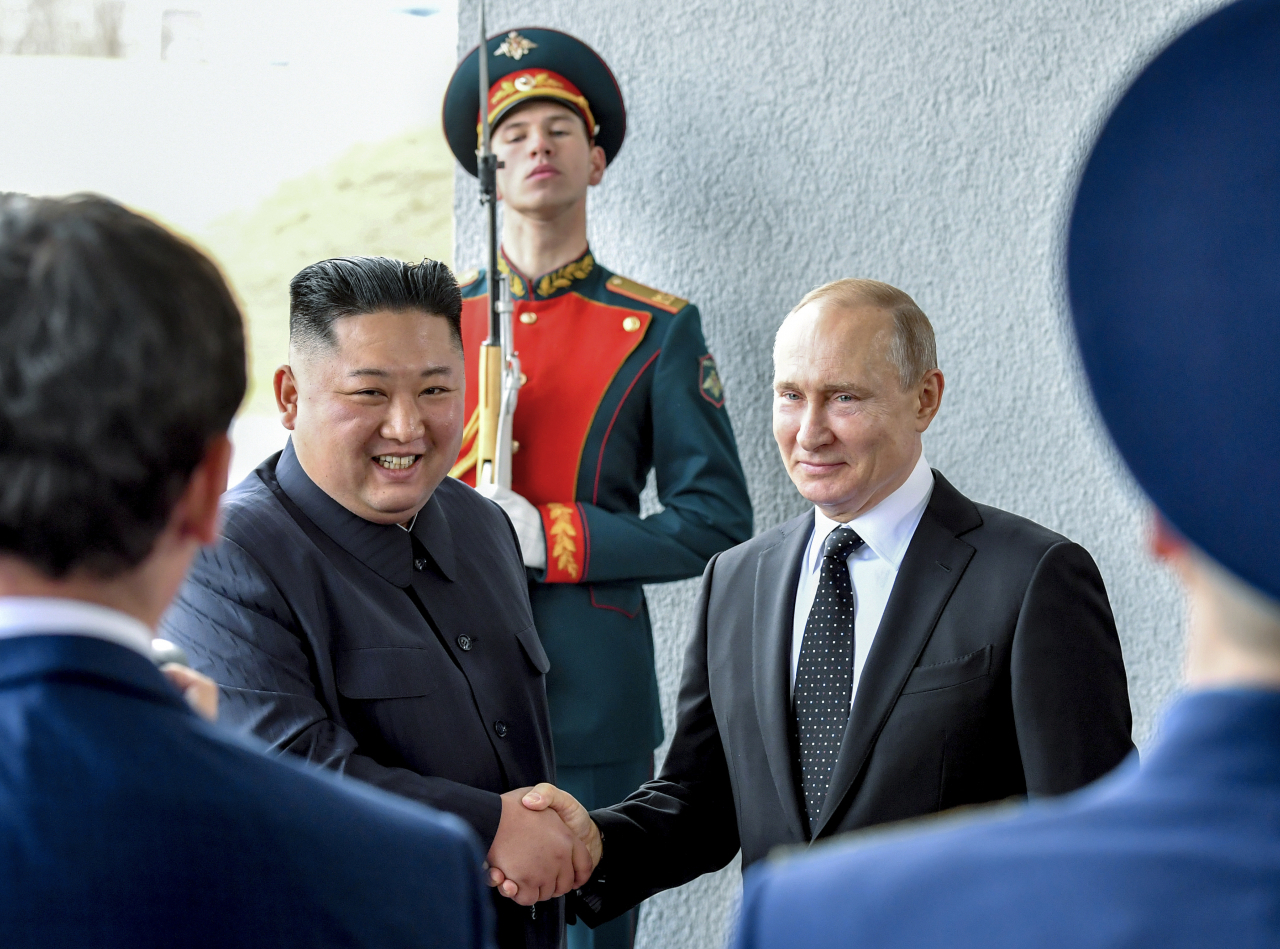 Russian President Vladimir Putin (right) and North Korea's leader Kim Jong-un shake hands during their meeting in Vladivostok, Russia, on April 25, 2019. (File Photo - AP)
