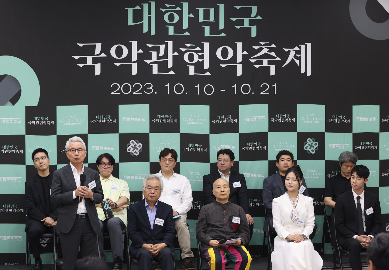 Ahn Ho-sang, CEO of the Sejong Center for the Performing Arts, (first in left, front row) speaks during a press conference held for the 2023 Korean Traditional Music Orchestra Festival, on Wednesday. (Yonhap)