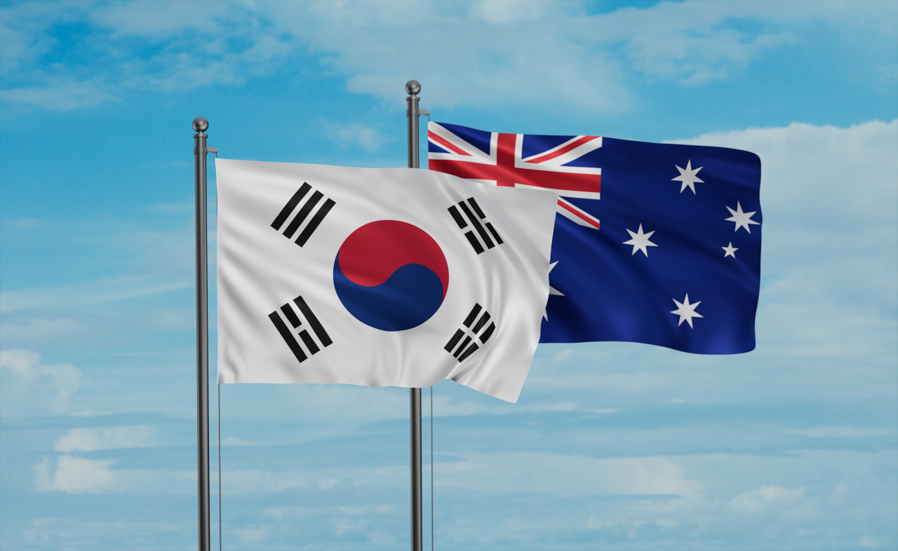 The South Korean (left) and Australian flags. (123rf)