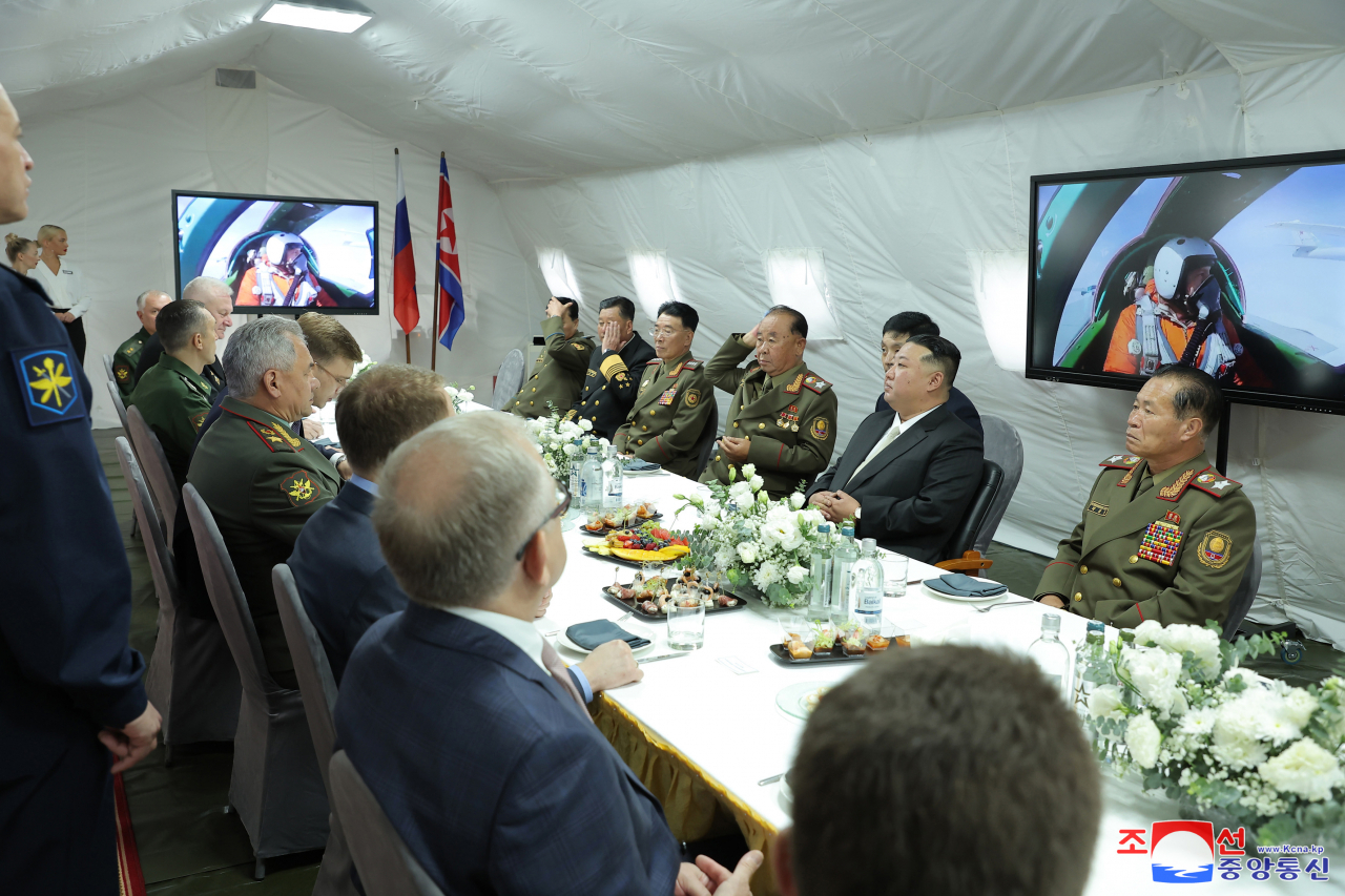 North Korean officials attended a meeting between North Korean leader Kim Jong-un and Russian Defense Minister Sergei Shoigu in the Russian port city of Vladivostok on Sept. 16, in the photo released by North Korea's state-run Korean Central News Agency. (Yonhap)