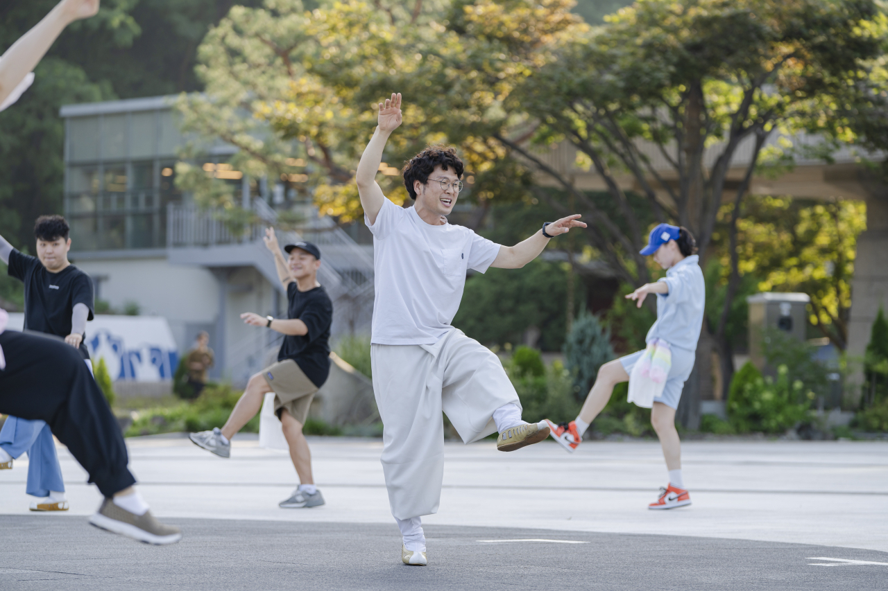 Dancers perform during a previous talchum workshop in the outdoor plaza in front of the National Theater of Korea's Haeoreum Grand Theater. (National Theater of Korea)