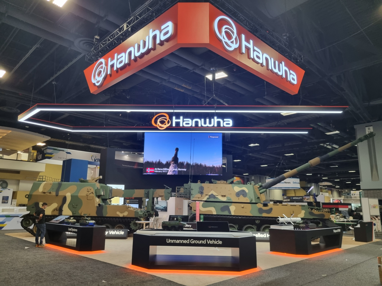 Hanwha Aerospace’s exhibition booth showcases the K-9 Thunder, an automatic ammunition resupply vehicle, a modular charge system, the Arion-SMET and other key ground-launched weapons systems at the Association of the United States Army exhibition held Monday in Washington. (Hanwha Aerospace)