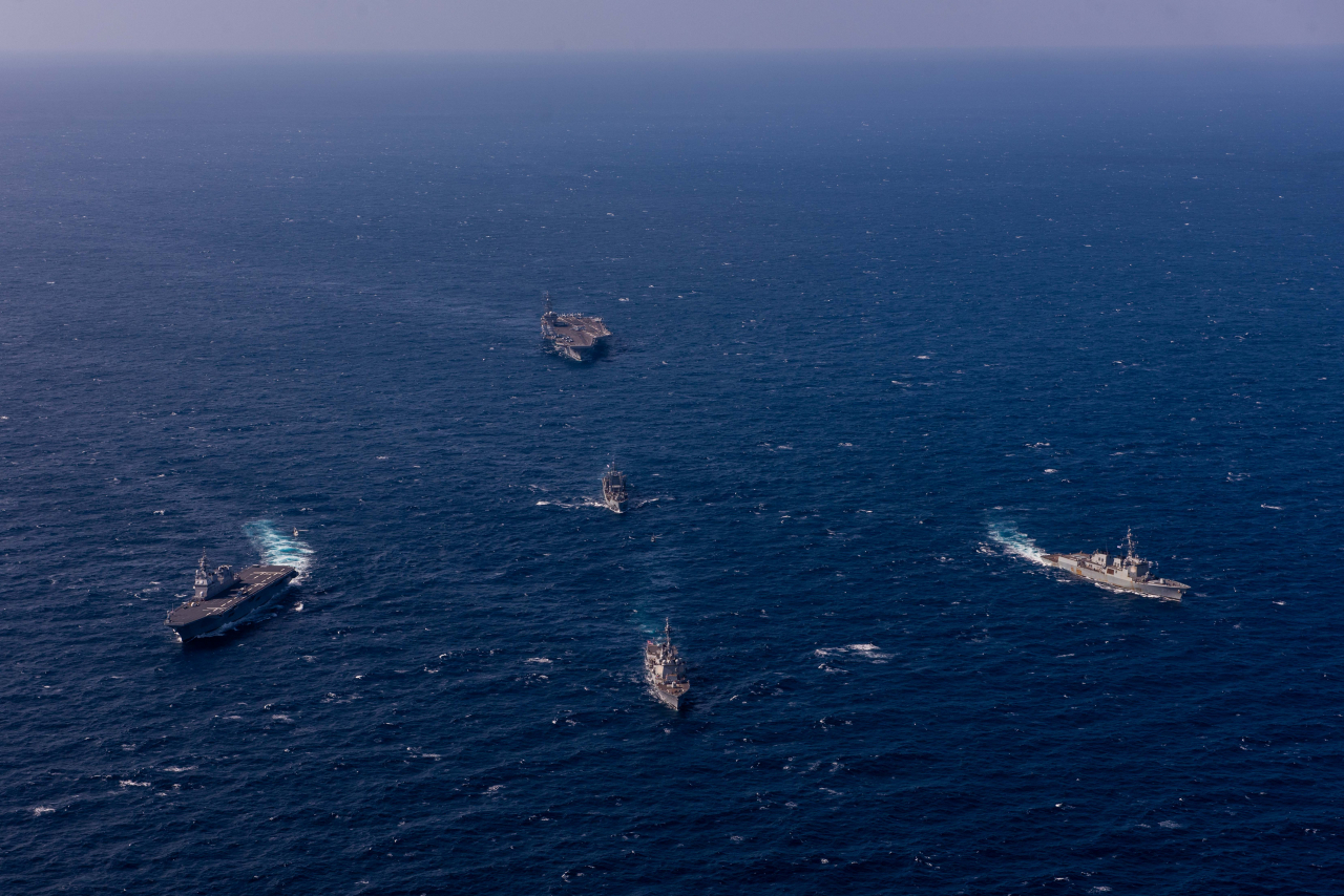 This file photo, provided by the South Korean Navy, shows naval ships, including the USS Ronald Reagan aircraft carrier, participating in a joint anti-submarine drill of South Korea, the US and Japan in the East Sea on Sept. 30. (Yonhap)