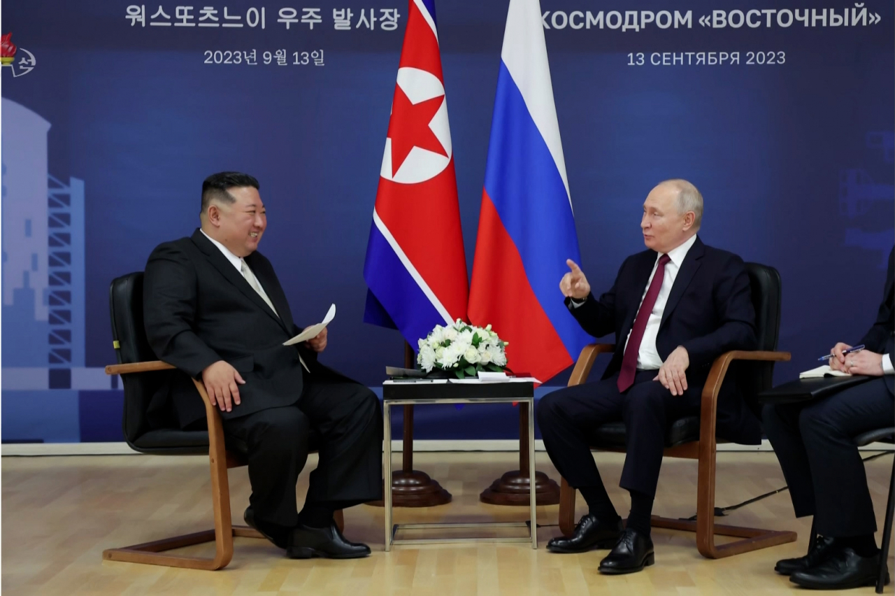 This file photo, captured from footage from North Korea's state-run Korea Central Television on September 14, shows North Korean leader Kim Jong-un (left) and Russian President Vladimir Putin holding talks in Russia the previous day. (Yonhap)