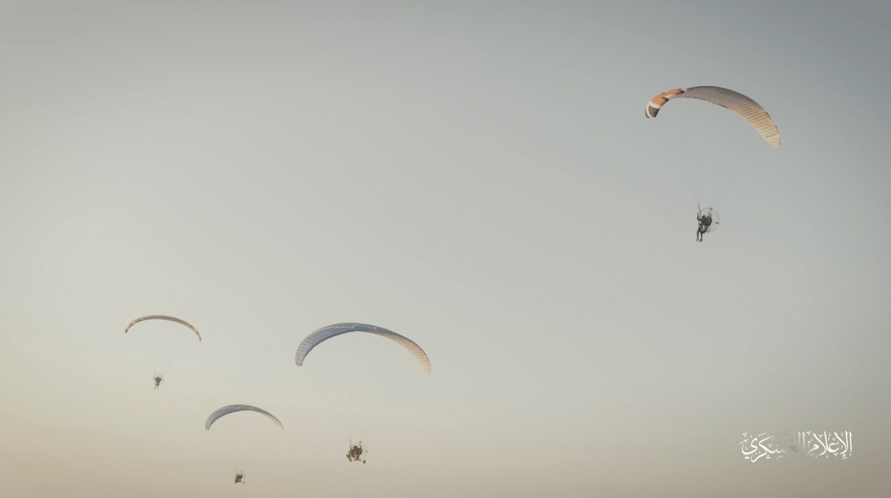 Hamas's armed wing IIzz el-Deen al-Qassam Brigades train with paragliders as they prepare for an armed air assault, in this screengrab obtained from a social media video released by Izz el-Deen al-Qassam Brigades on October 7. (Reuters)
