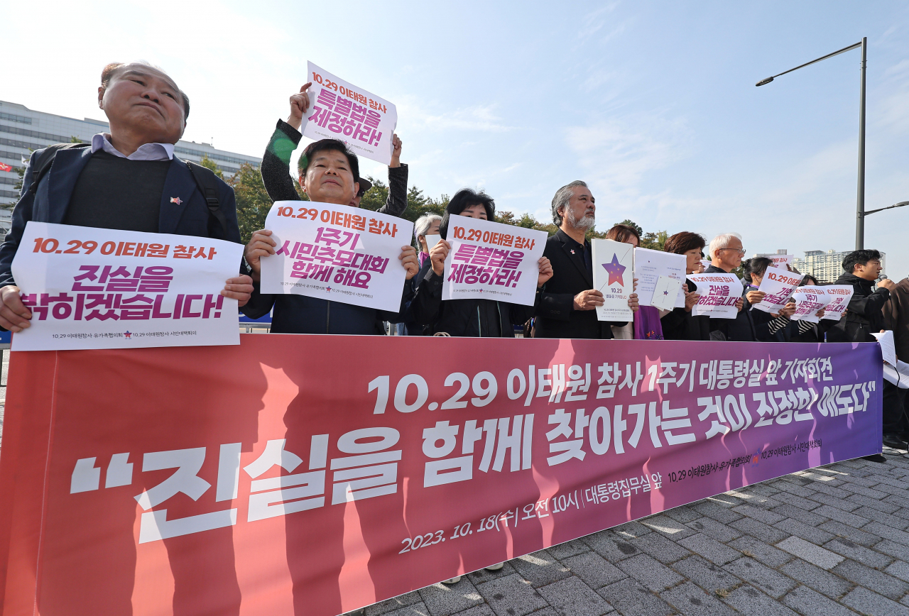 The bereaved families of the Itaewon tragedy and civic groups hold a press conference in front of the presidential office to mark the upcoming one-year anniversary of the tragic crowd crush, in Yongsan-gu, Wednesday. (Yonhap)