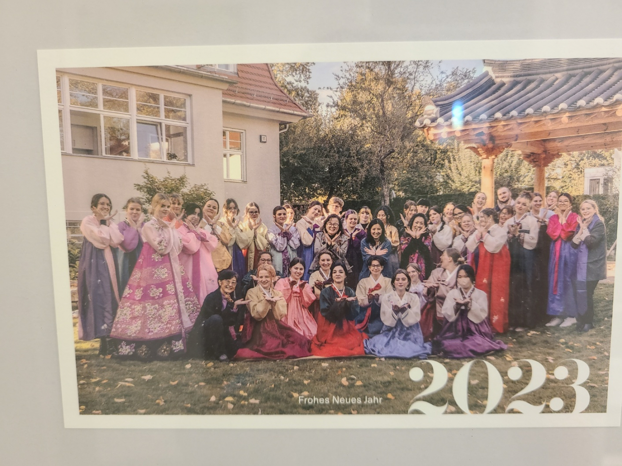 A group photo of Korean Studies students at Free University of Berlin wearing hanbok hangs on the wall of FUB's Institute of Korean Studies building. (Jung Min-kyung/The Korea Herald)
