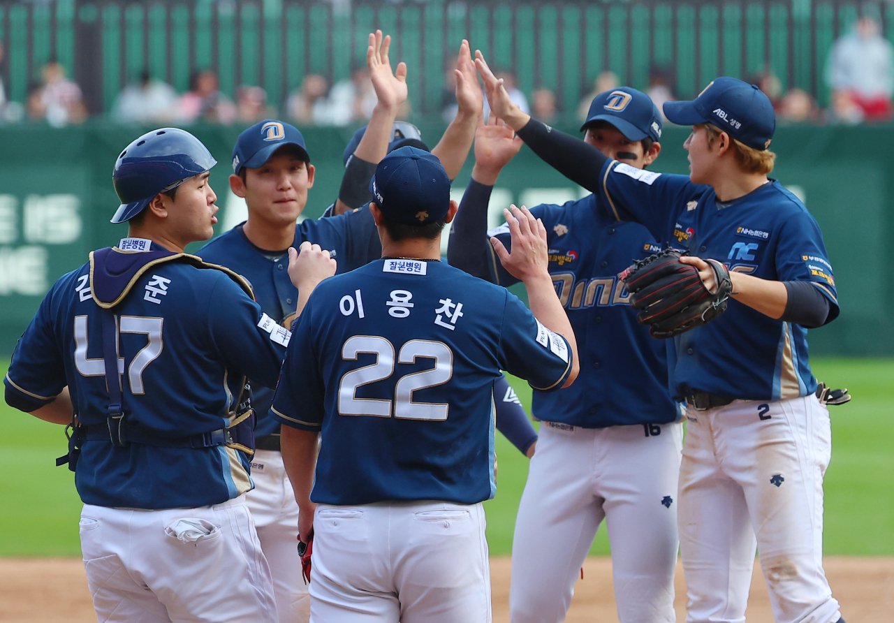NC Dinos players celebrate their 4-3 win over the SSG Landers in Game 1 of the first round series in the Korea Baseball Organization postseason at Incheon SSG Landers Field in Incheon, west of Seoul, on Oct. 22, 2023. (Yonhap)