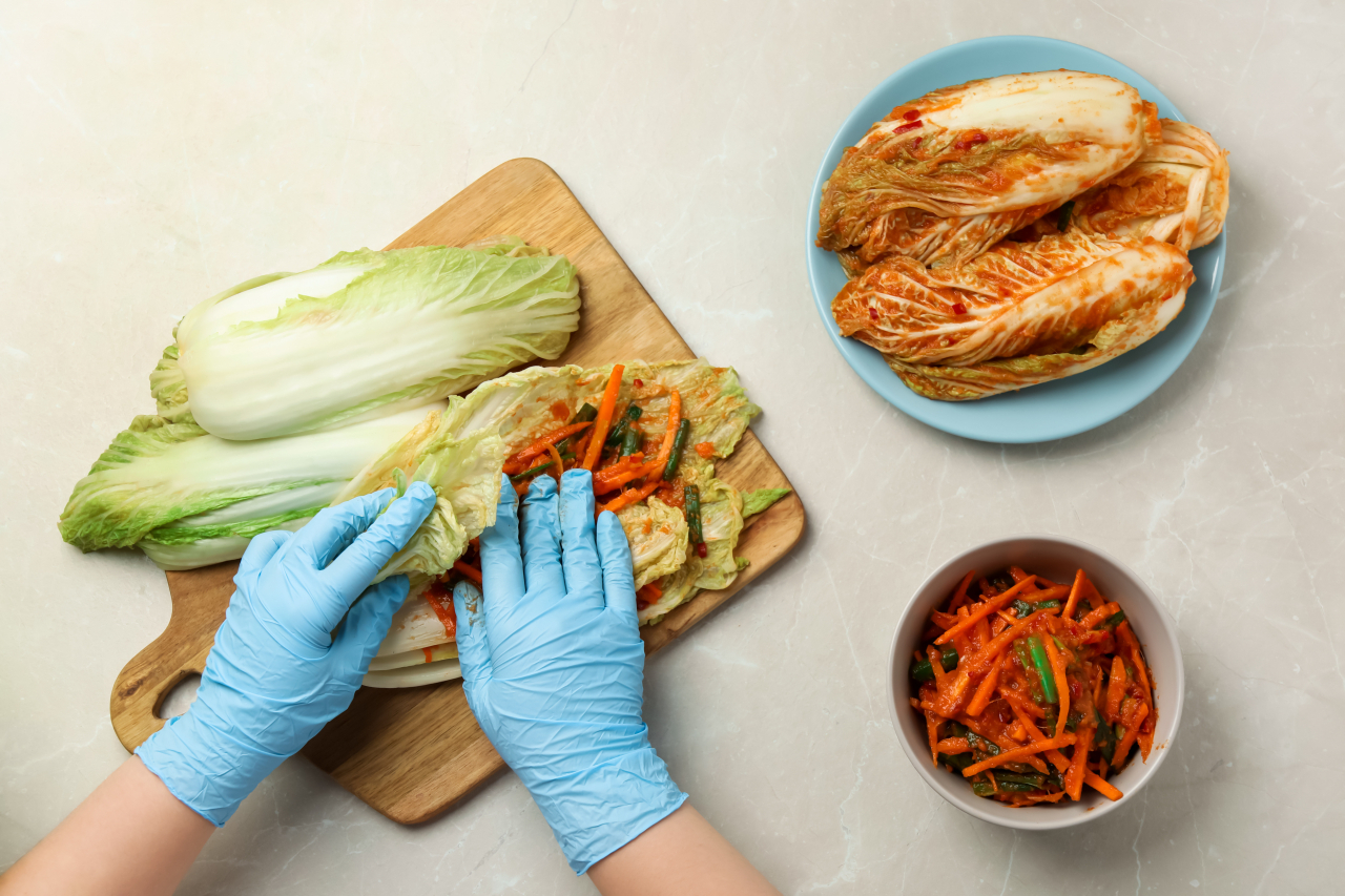 Cabbage is stuffed with seasoned julienned radish to make kimchi. (123rf)