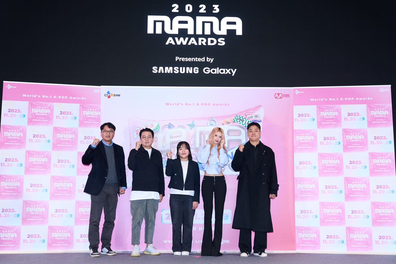 (From left) Park Chan-uk, general manager of Mnet, producer Lee Young-joo, producer Shin Yu-sun, K-pop singer Jeon Somi and producer Lee Hyoung-jin pose for pictures during the 2023 Mama Awards media day held in Seoul on Wednesday. (Mnet)