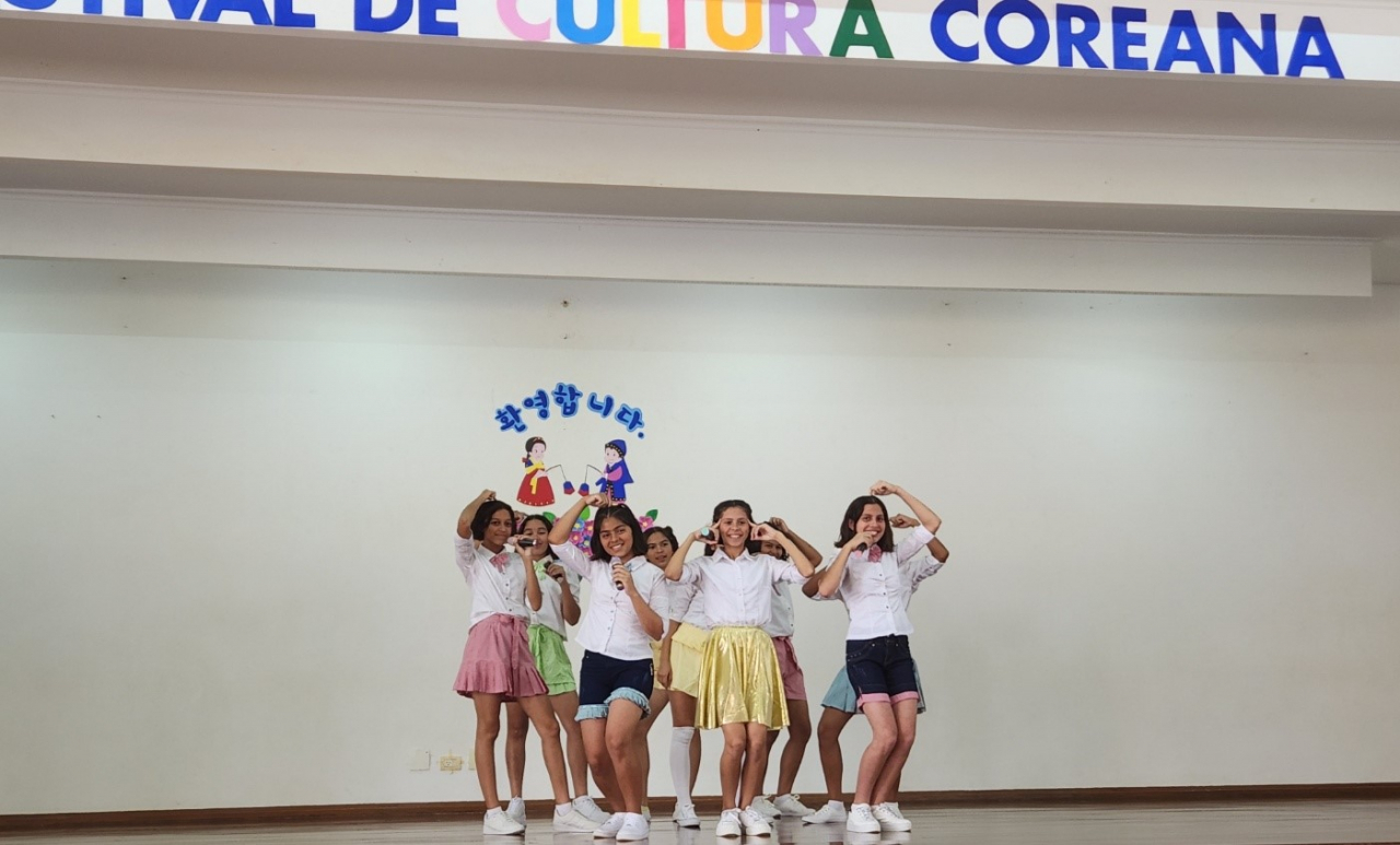 Students of the Sisters of Mary Girlstown Brasilia perform a K-pop dance cover on stage as part of the Korean Culture Festival, held on Oct. 26 at the school located in Brazil's capital city. (Lee Sun-young/The Korea Herald)
