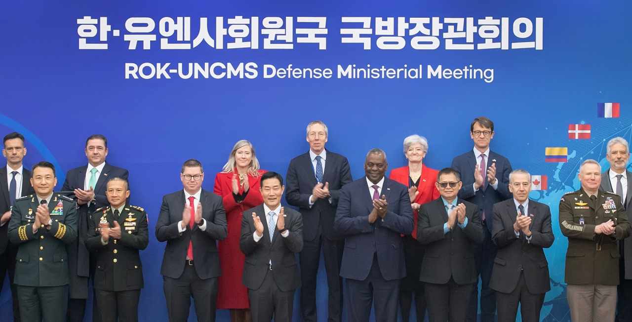 South Korean Defense Minister Shin Won-sik (fourth from left), US Secretary of Defense Lloyd Austin (fourthfrom right), commander of the United Nations Command Paul LaCamera (far right) and Australian Minister for Defense Industry Pat Conroy (third from left) pose for a group photograph with other representatives at the inaugural defense ministerial meeting between South Korea and United Nations Command member states in Seoul on Tuesday. (Defense Ministry)
