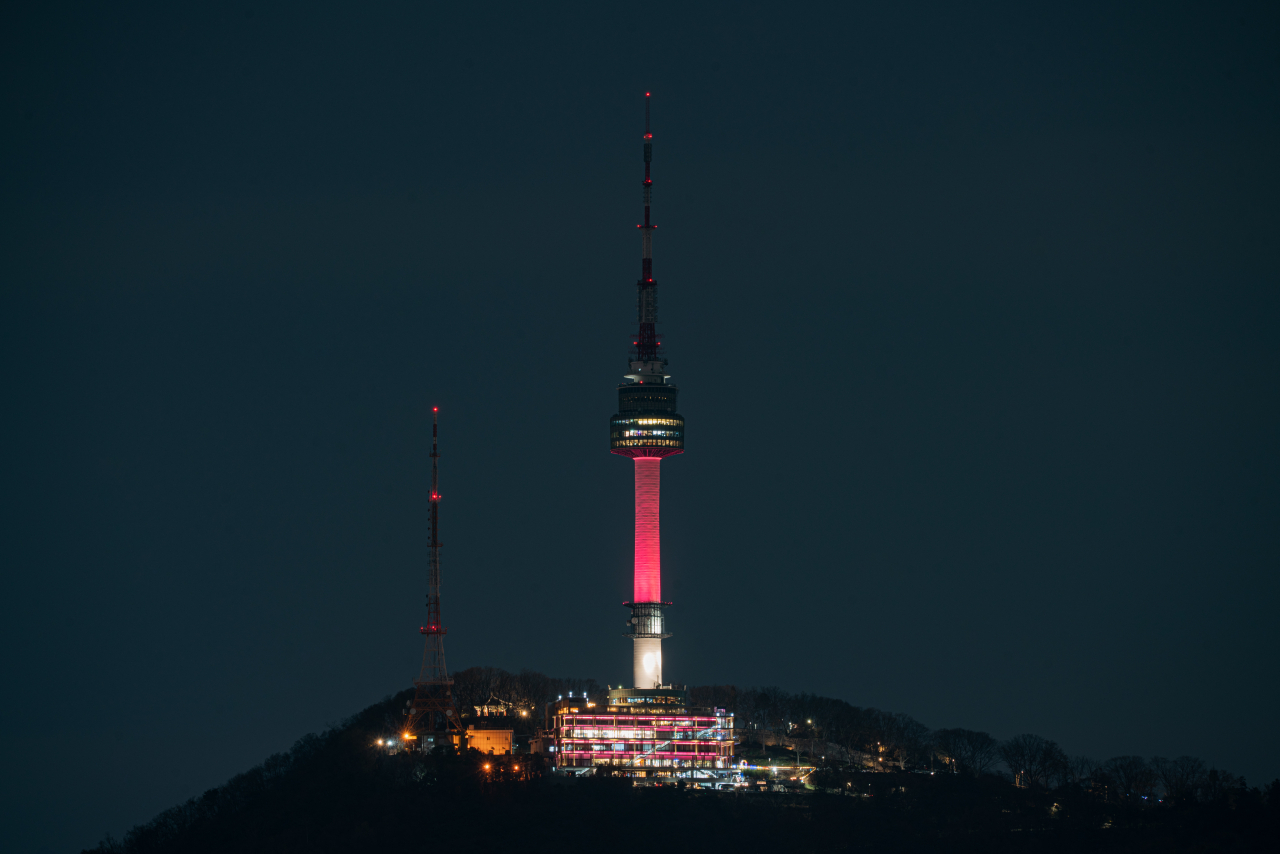 The N Seoul Tower in Yongsan-gu, central Seoul, is lit up in sky coral, the 
