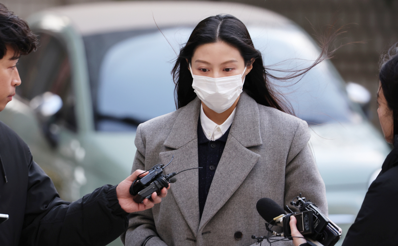 Cho Min, daughter of ex-Justice Minister Cho Kuk, attends the first hearing for her trial at the Seoul Central District Court on Friday. (Yonhap)