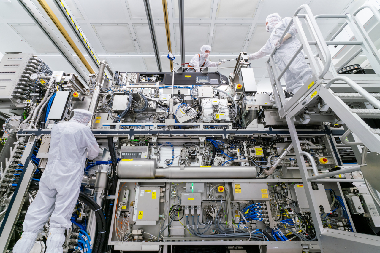 ASML employees assemble a machine inside a clean room at the company's headquarters in Veldhoven, the Netherlands. (ASML)