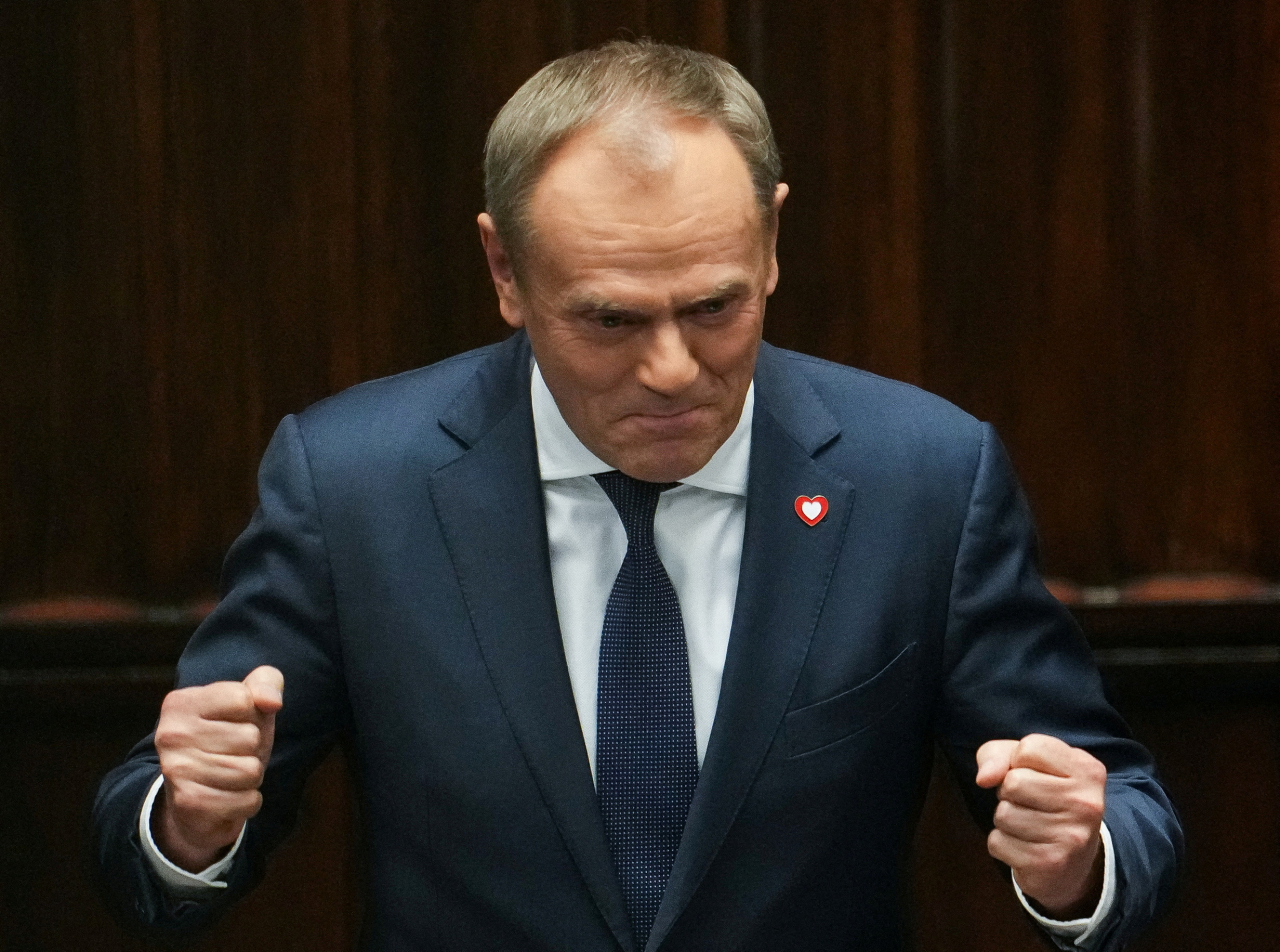 Leader of the Civic Coalition Donald Tusk gestures after the Parliament voted in favor of him becoming the Prime Minister, in Parliament, in Warsaw, Poland, on Monday. (Yonhap-Reuters)