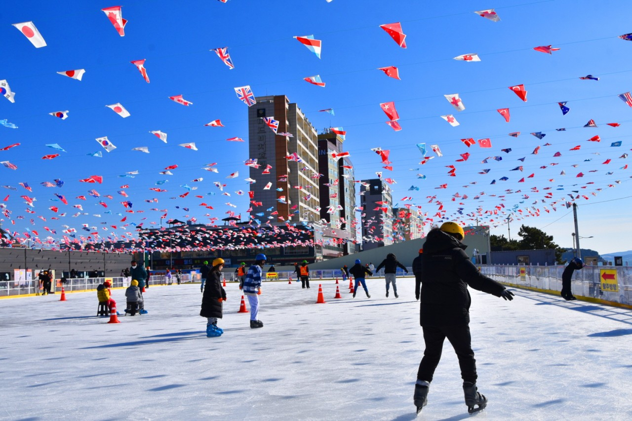 Skaters slide across the ice of a rink at Mud Square, on Daecheon Beach in Boryeong, South Chungcheong Province. (Boryeong City)