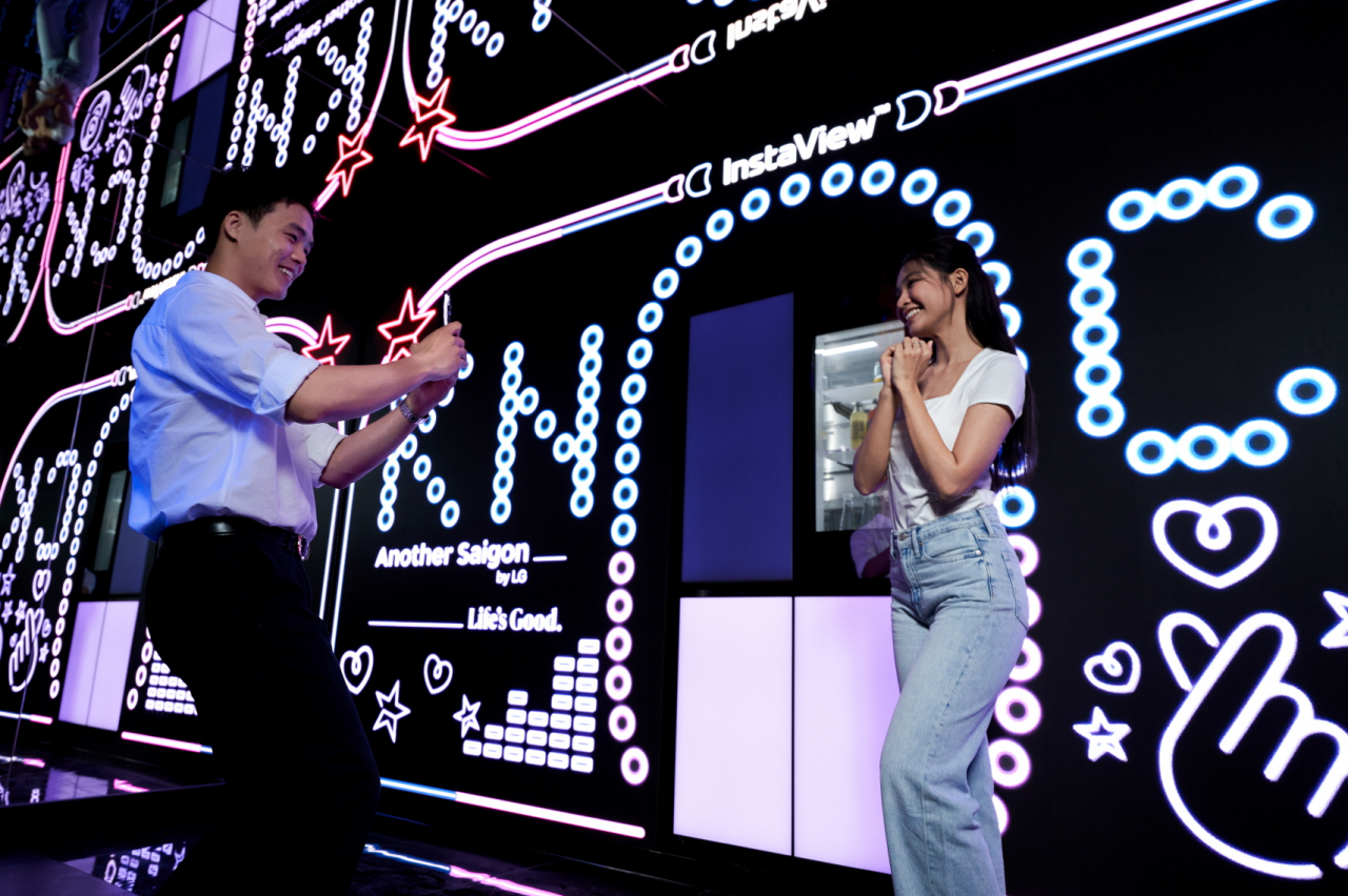 Visitors explore LG Electronics' experience zone, called “Another Saigon,” in Ho Chi Minh, Vietnam. (LG Electronics)