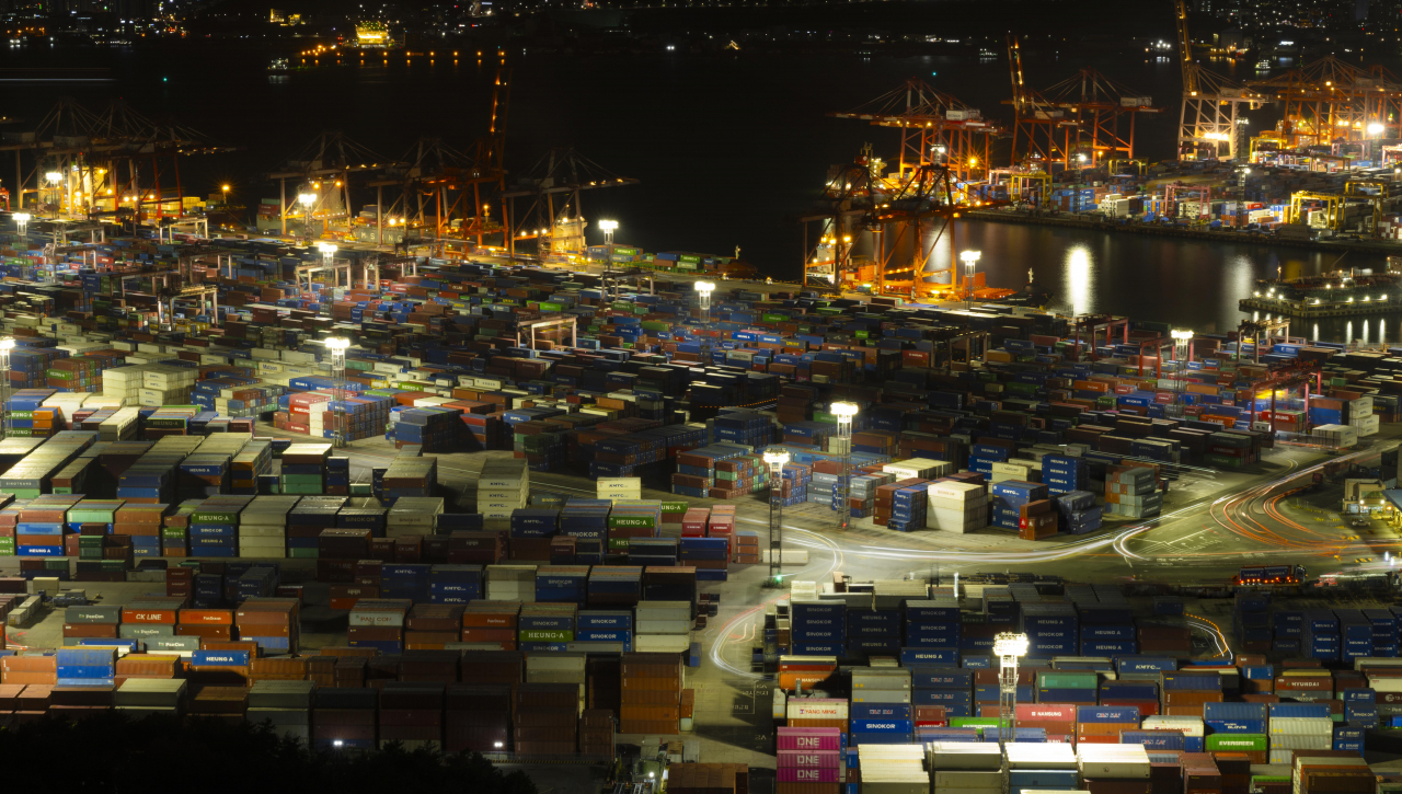 Shipping containers are stacked at a pier in South Korea's largest port city of Busan, Thursday. (Im Se-jun/The Korea Herald)