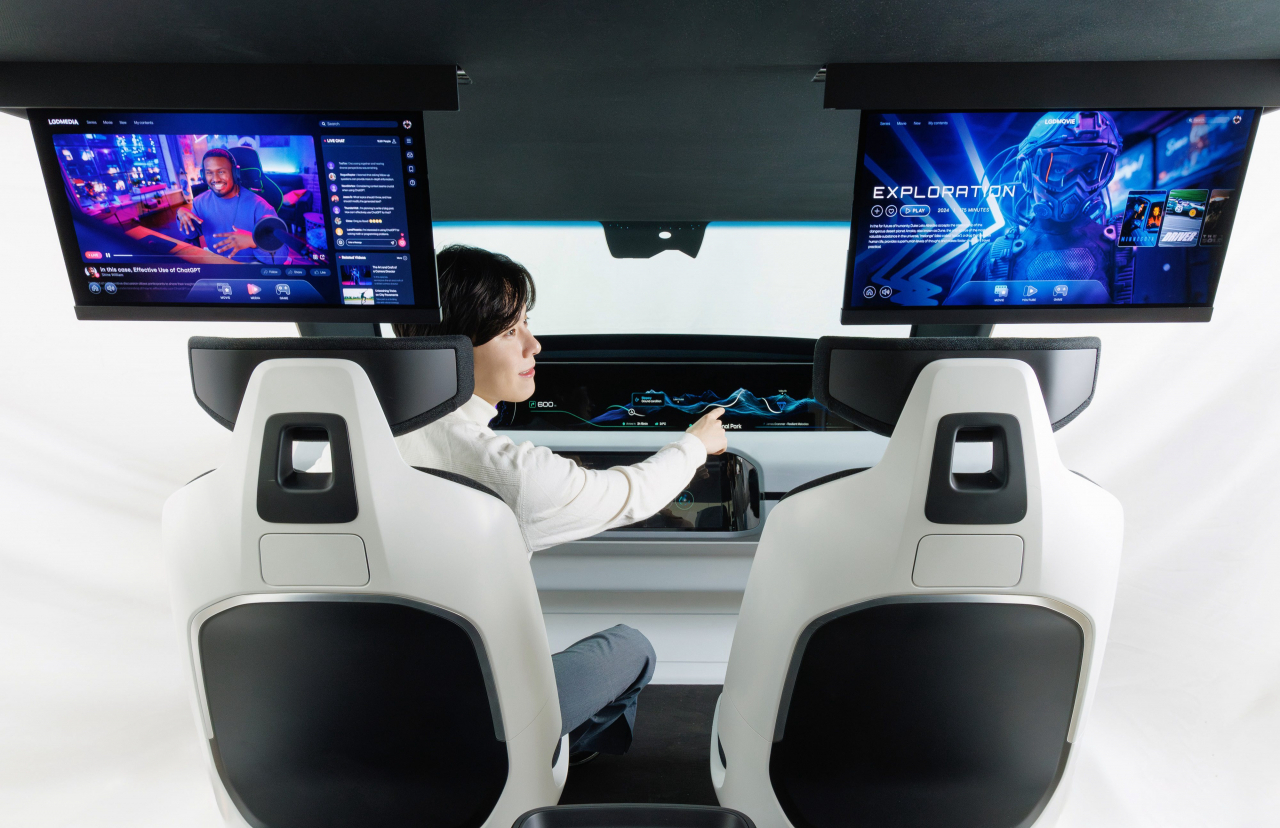 LG Display's new digital cockpit features a 48-inch pillar-to-pillar LCD dashboard together with 8-inch slidable OLED screens for rear passengers. (LG Display)