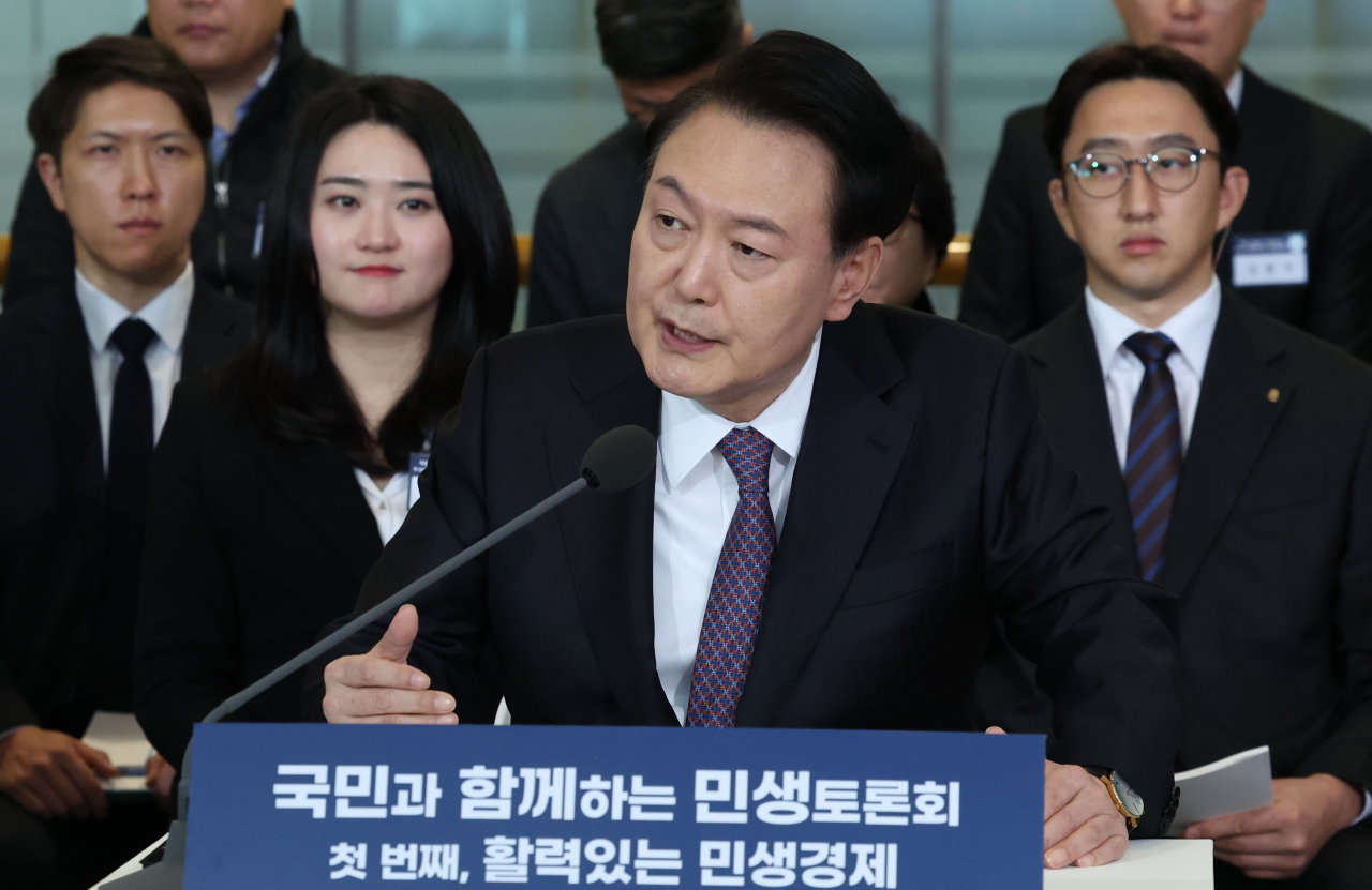 President Yoon Suk Yeol speaks during a public debate to discuss policy items with ordinary people and outside experts in Yongin, Gyeonggi Province, on Thursday. (Pool photo via Yonhap)
