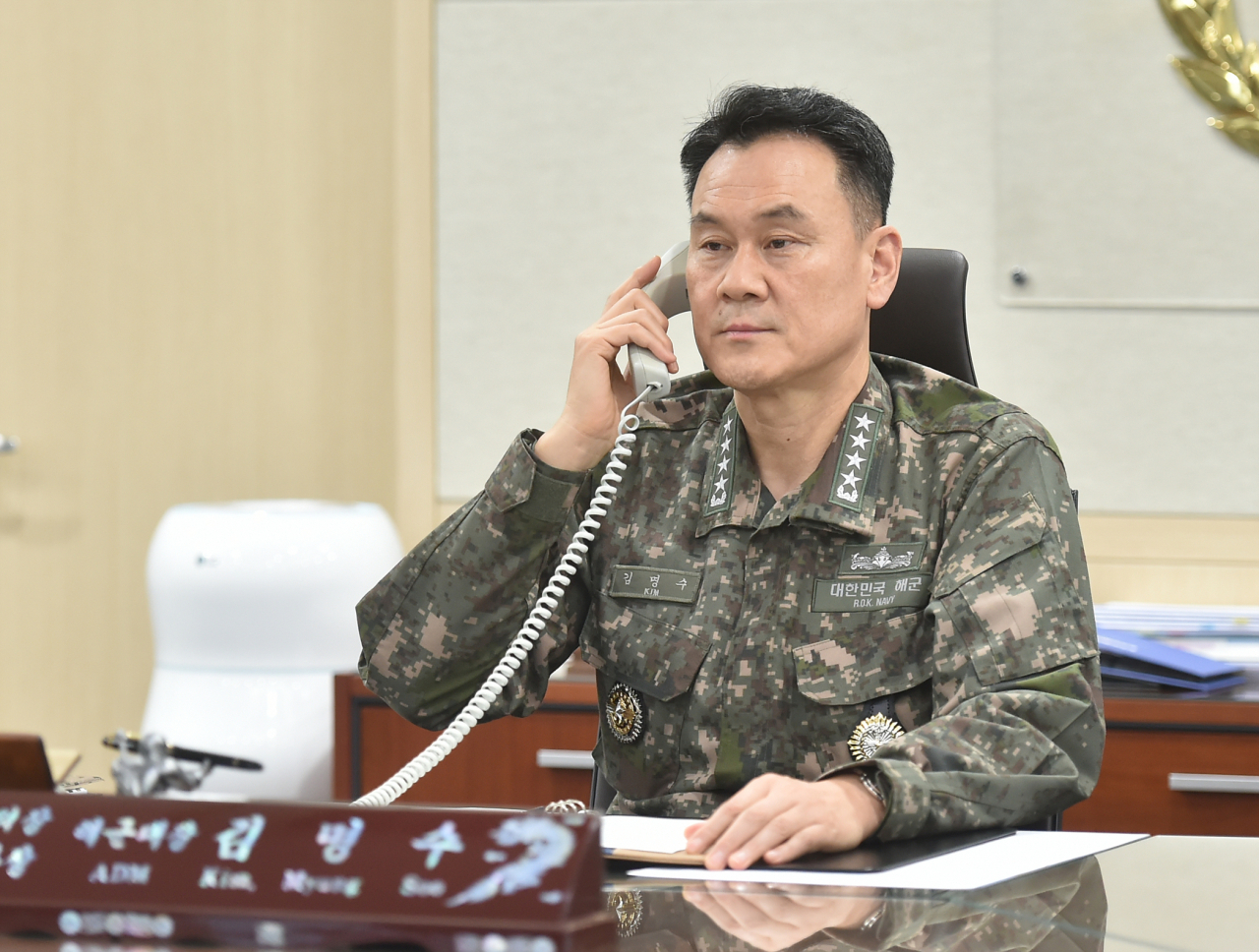 Joint Chiefs of Staffs Chairman Adm. Kim Myung-soo speaks over the phone with Adm. Rob Bauer, chair of NATO's military committee on Tuesday. (Yonhap)