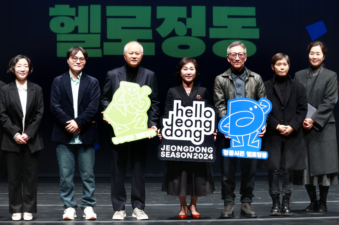 Directors of the creative teams for Jeongdong Theater's 2024 season and Jeongdong Theater CEO Choung Soung-sook (center) pose for a group photo after a press conference at the National Jeongdong Theater of Korea, Wednesday. (Yonhap)