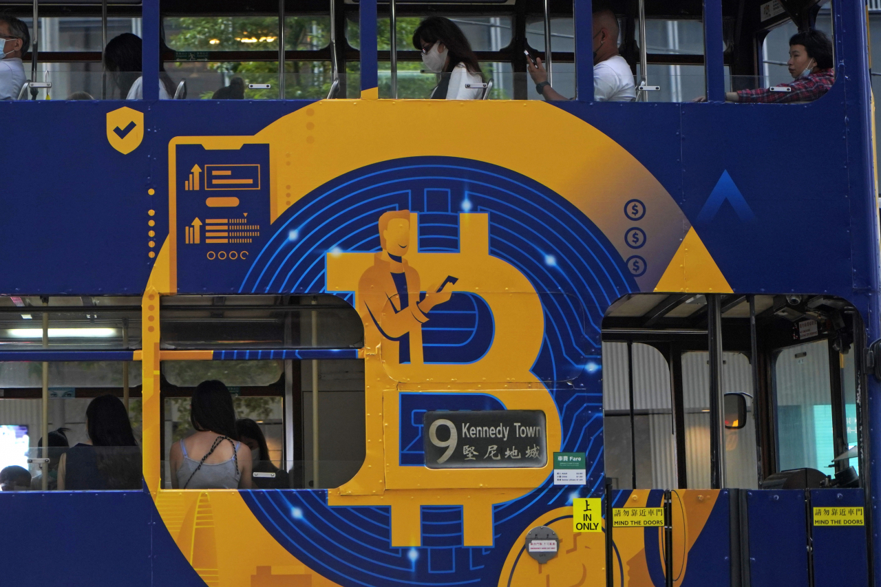 An advertisement for the cryptocurrency bitcoin displayed on a tram in Hong Kong on May 12, 2021. (AP-Yonhap)