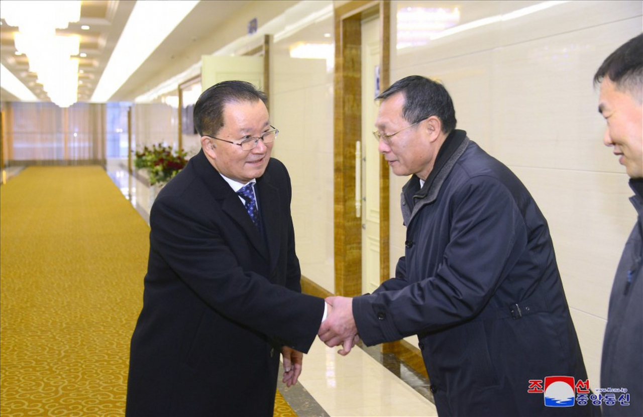 Kim Son-kyong (left), North Korea's vice foreign minister for international organizations, departs Pyongyang to attend the Non-Aligned Movement summit in Uganda. (KCNA)
