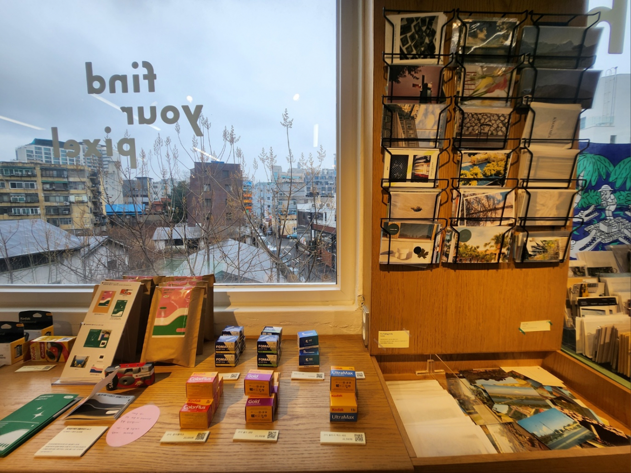Postcards and film boxes are on display at Pixel Per Inch, an independent bookstore and vintage photo and camera shop. (Lee Jung-youn/The Korea Herald)