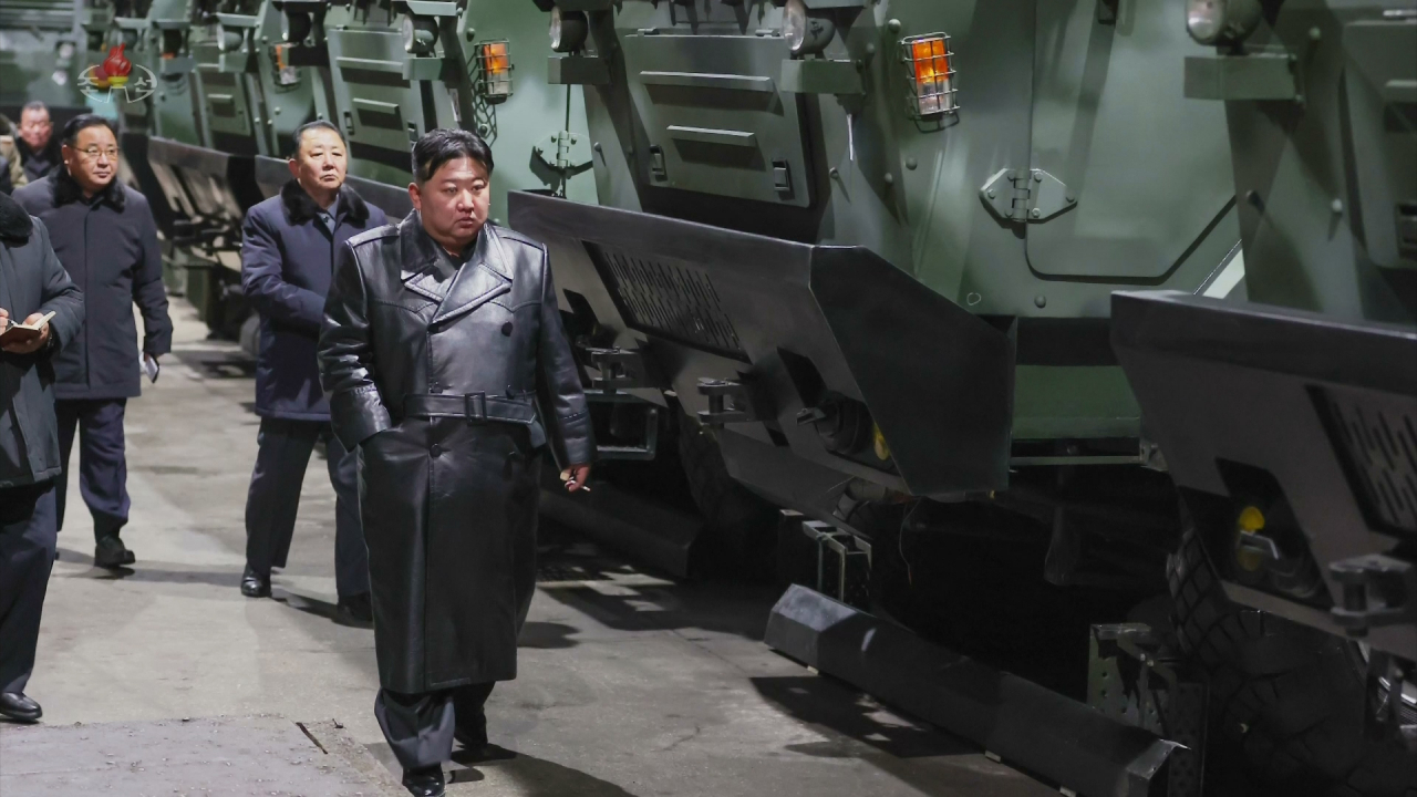 This photo shows North Korean leader Kim Jong-un (right) visiting an arms factory on Jan. 8, 2024. (KCNA)